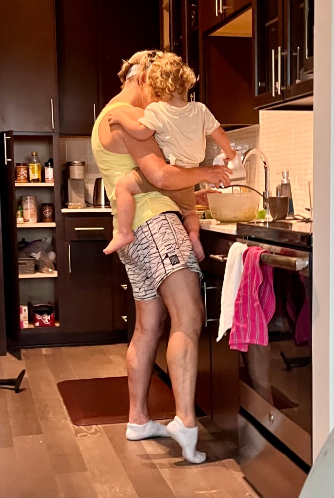 Grandma & Luke cooking at Grandma & Papaw's apartment during our "derecho storm" power outage.